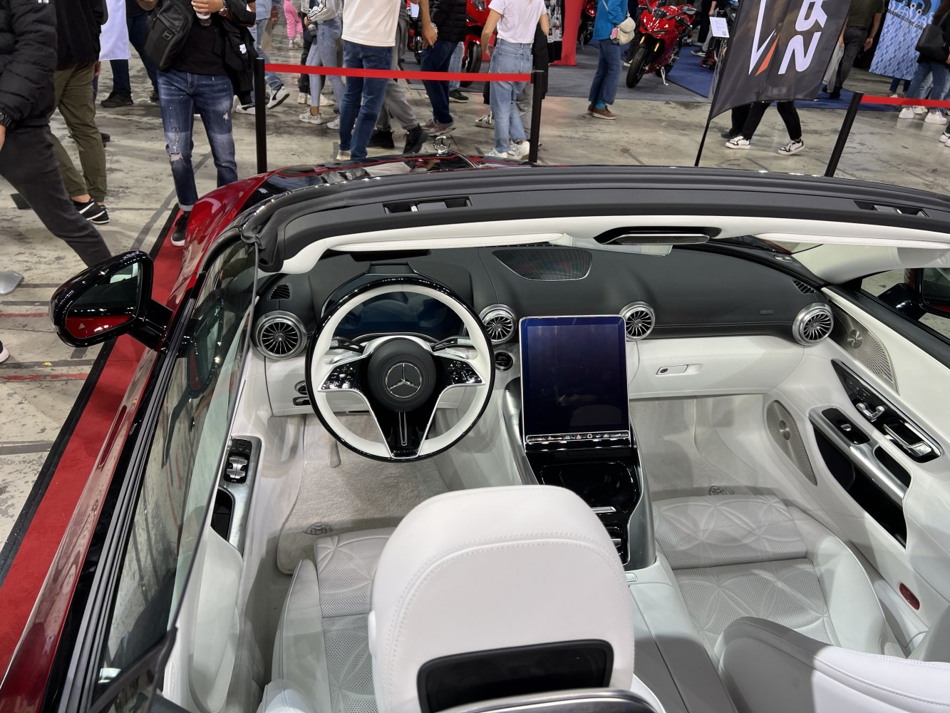 Luxury white interior with digital touchscreen and advanced steering wheel