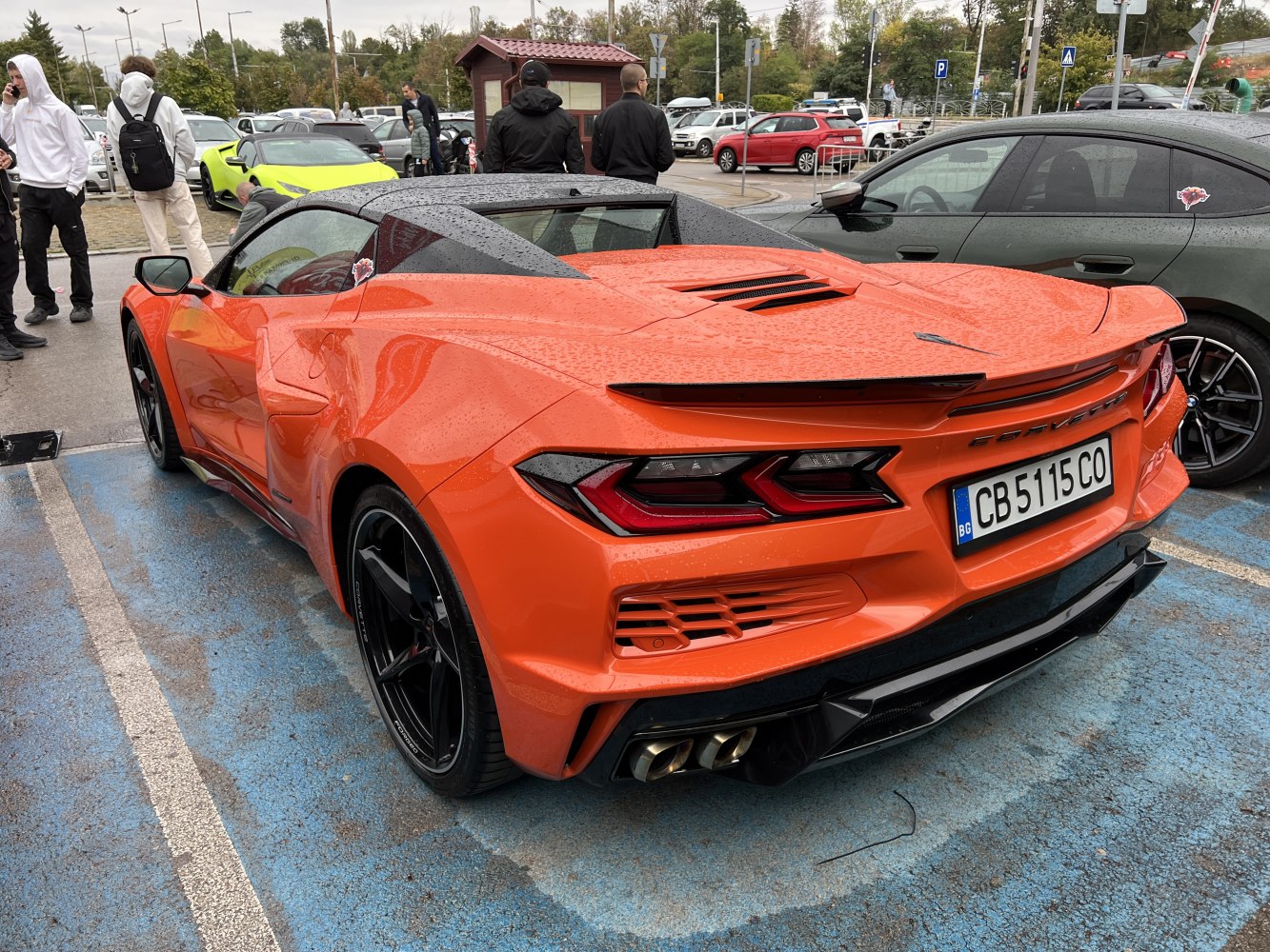 Rear view of a sports coupe with sharp taillights and dual exhaust.