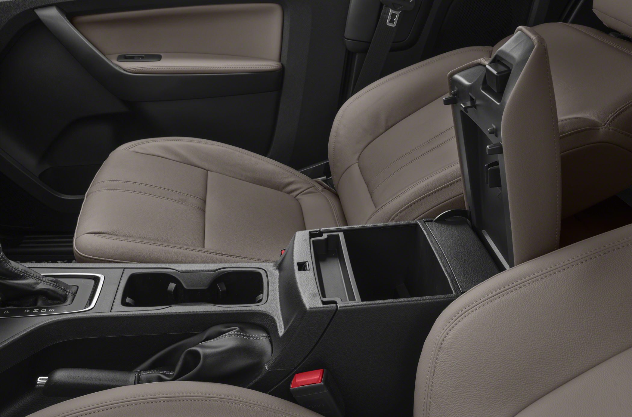 Leather seats and open center storage console with cup holders and handbrake.