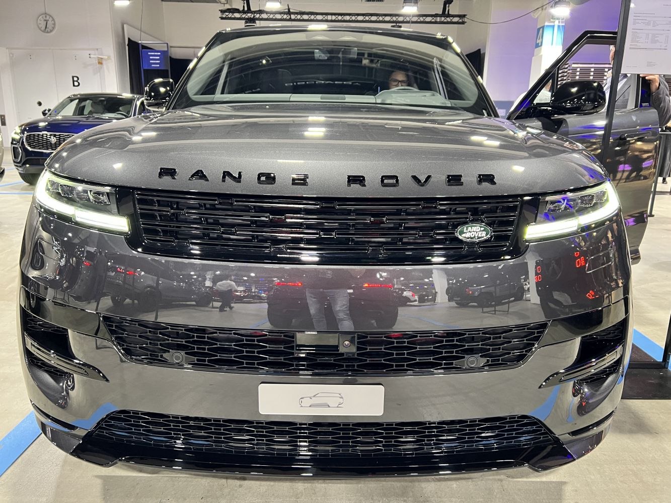 Close-up of front grille and LED headlights with Land Rover badge