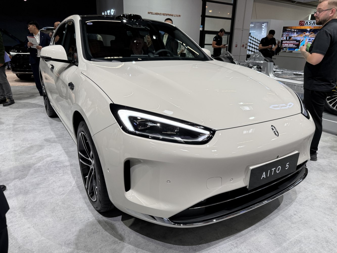 Front view of a car with sleek LED headlights and smooth hood