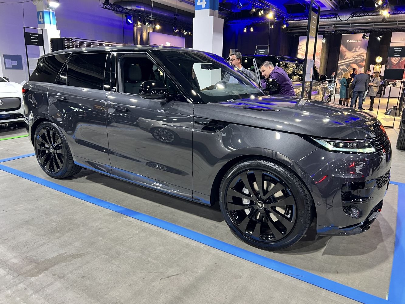 Side profile with sleek body and black alloy wheels