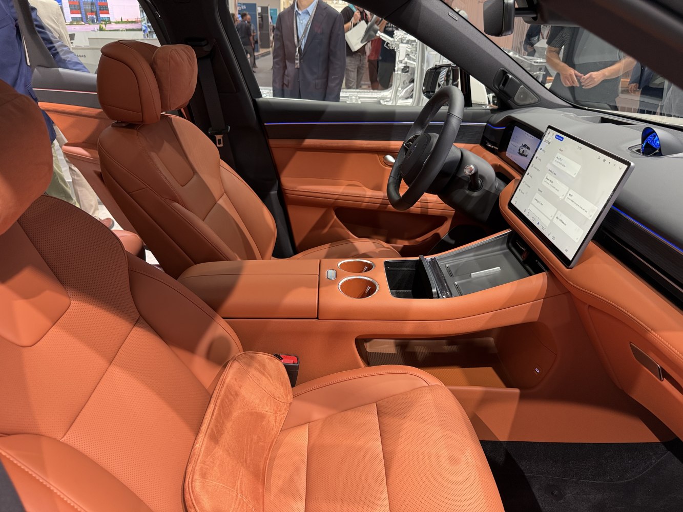 Brown leather seats and large central touchscreen dashboard