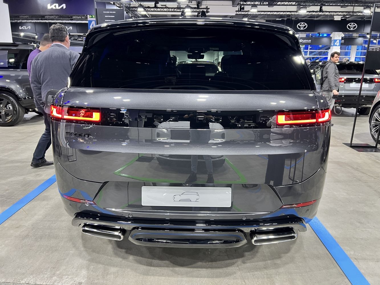 Rear taillights and dual exhaust tips of a sleek luxury SUV