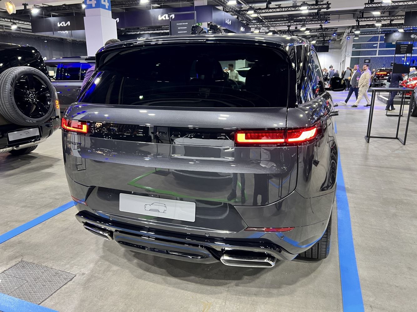 Rear view with sleek tail lights and dual exhaust pipes