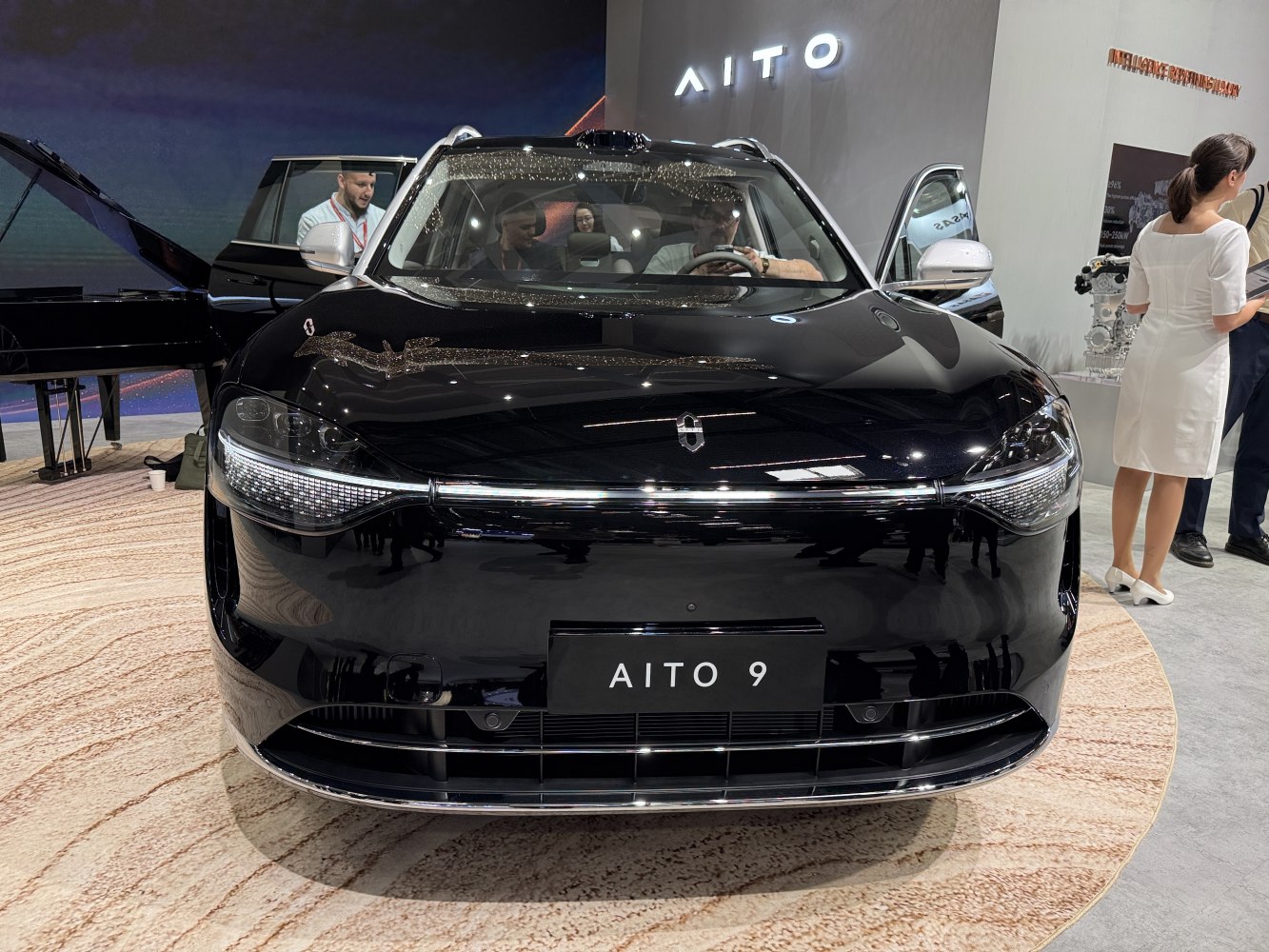 Front view with sleek headlights and chrome-accented grille