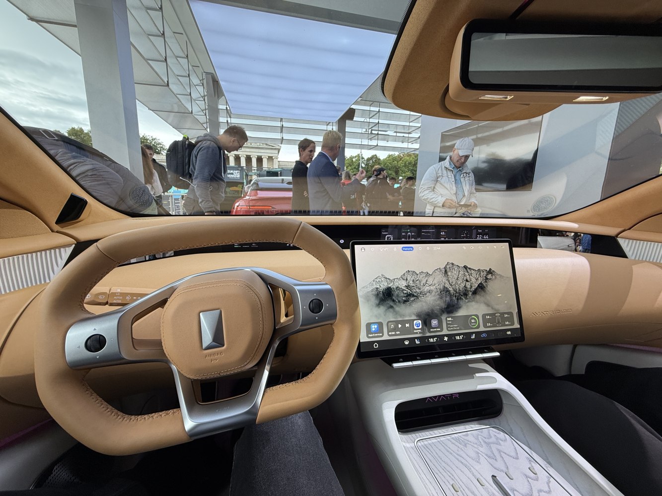 Futuristic digital dashboard with touchscreen and unique steering wheel