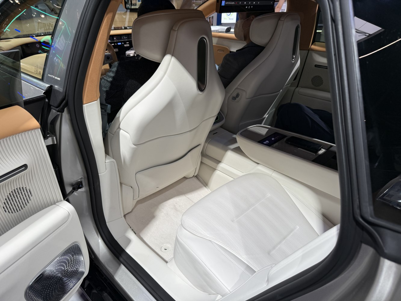 Rear interior with premium white leather seats and advanced center console