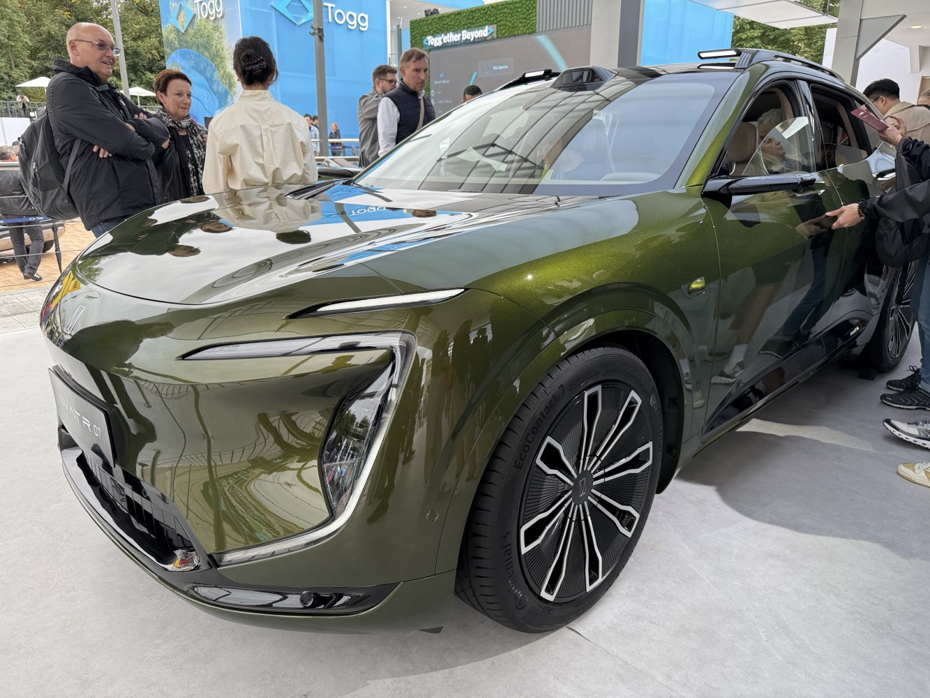 Advanced LED headlights and aerodynamic wheels on a sleek vehicle front.