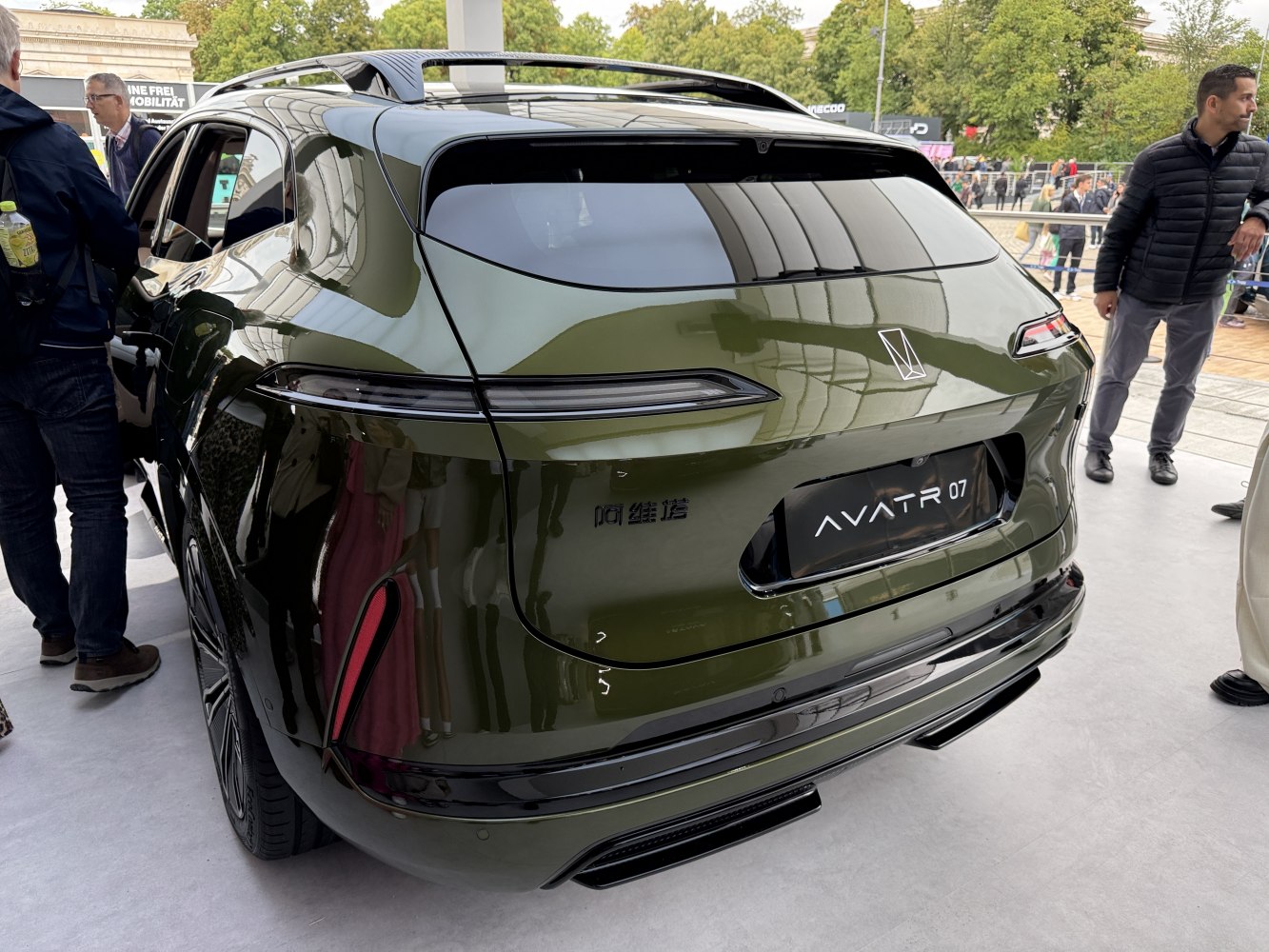 Glossy rear with sleek horizontal taillights and roof spoiler