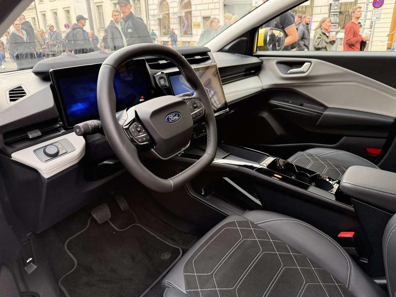 Modern car interior with digital displays and multifunction steering wheel