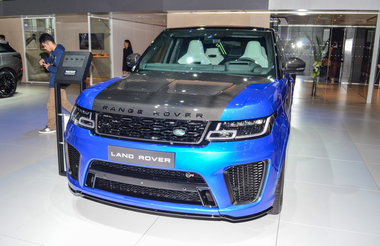 Front grille and carbon fiber hood of luxury SUV