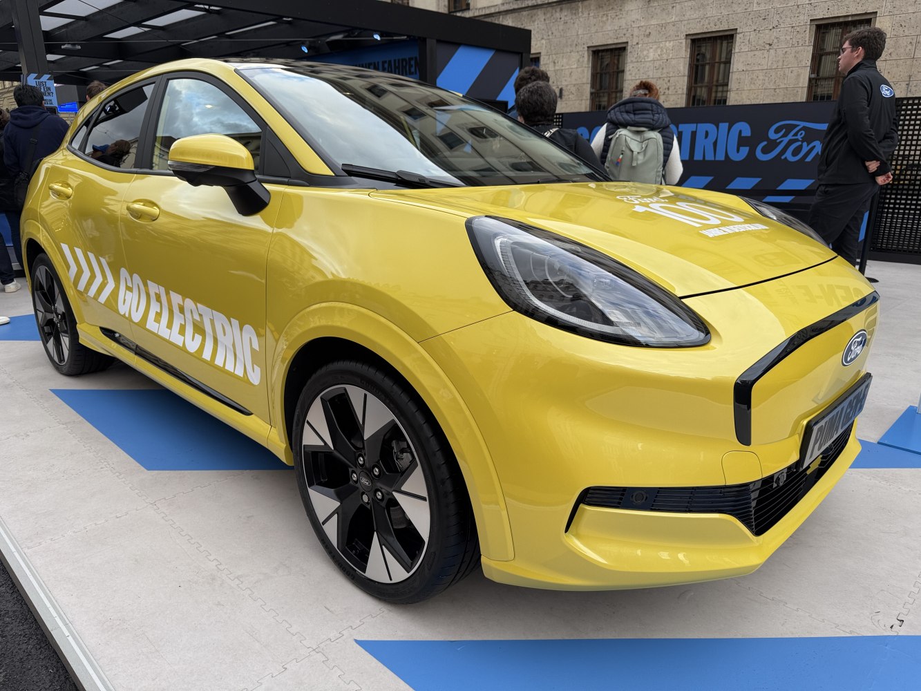 Electric yellow crossover with aerodynamic design, LED headlights, alloy wheels