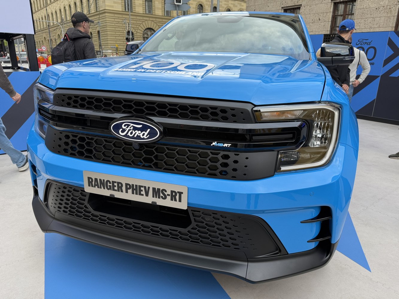 Front grille and headlights of a modern blue pickup