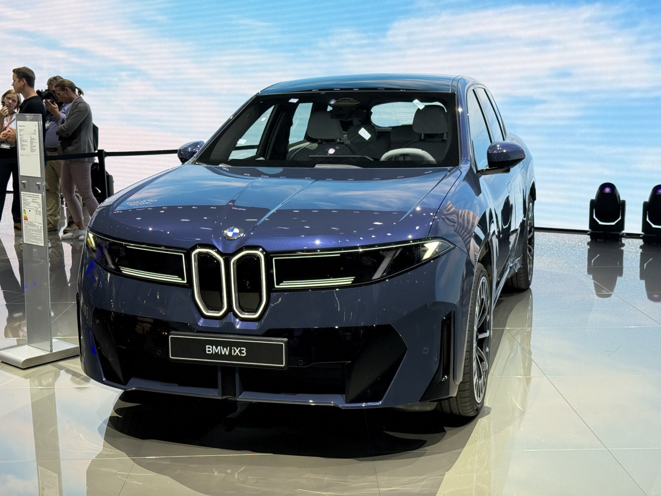 Front view of electric SUV with kidney grille and LED headlights