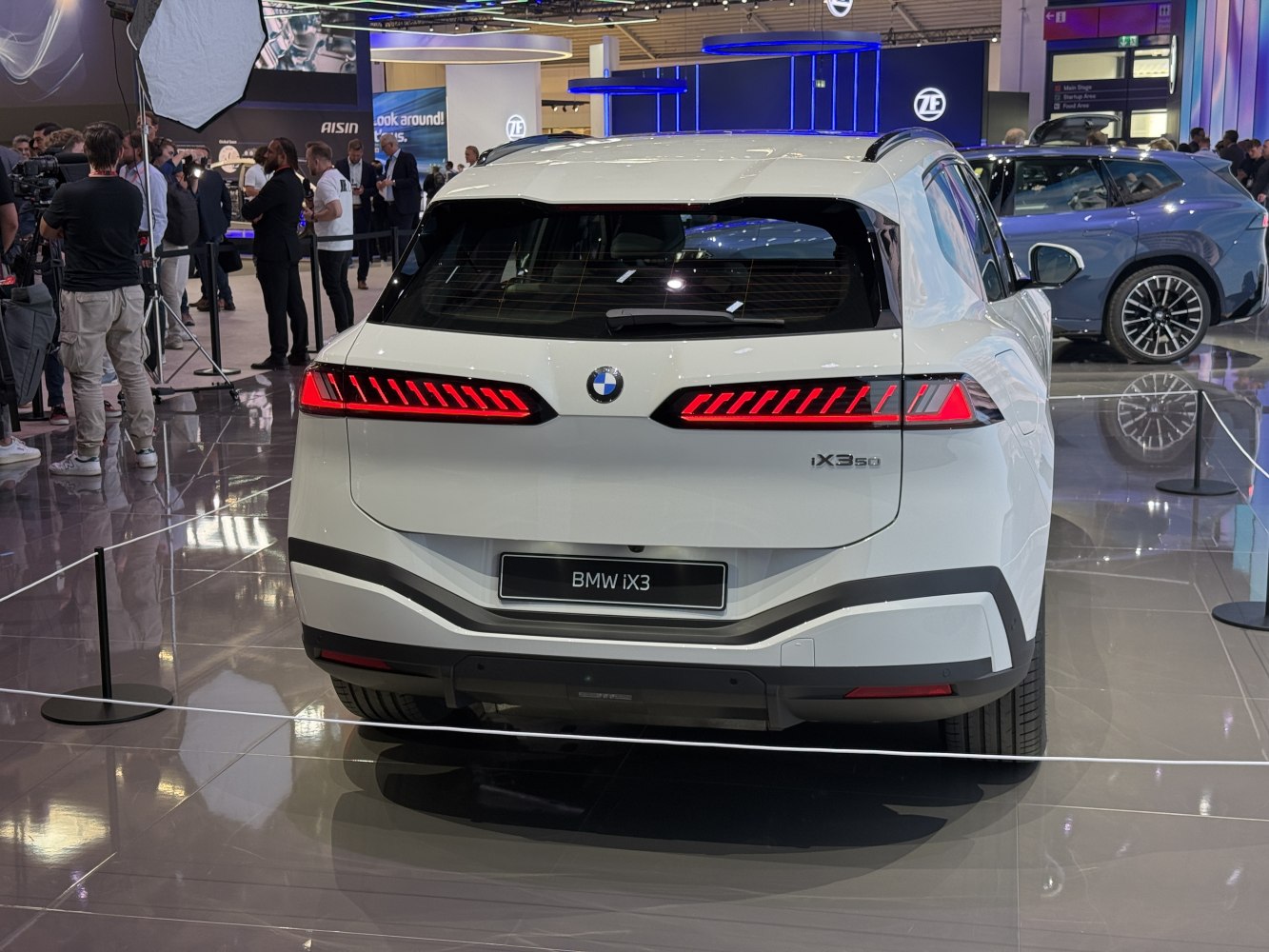 Rear view with LED tail lights of a white modern SUV