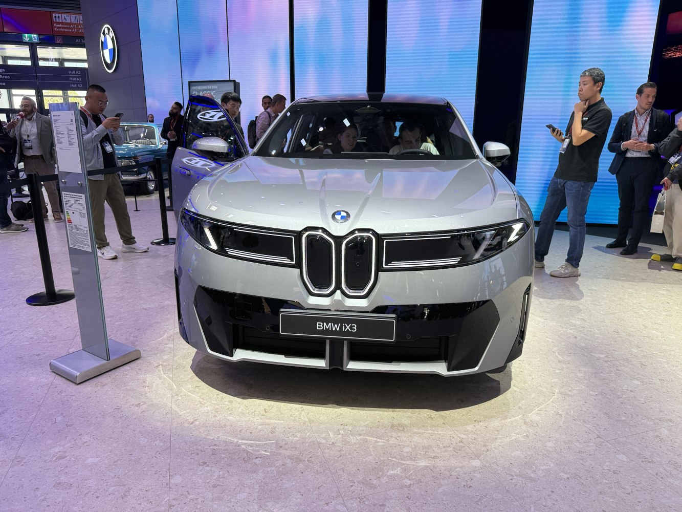 Futuristic front view with kidney grille and LED headlights.