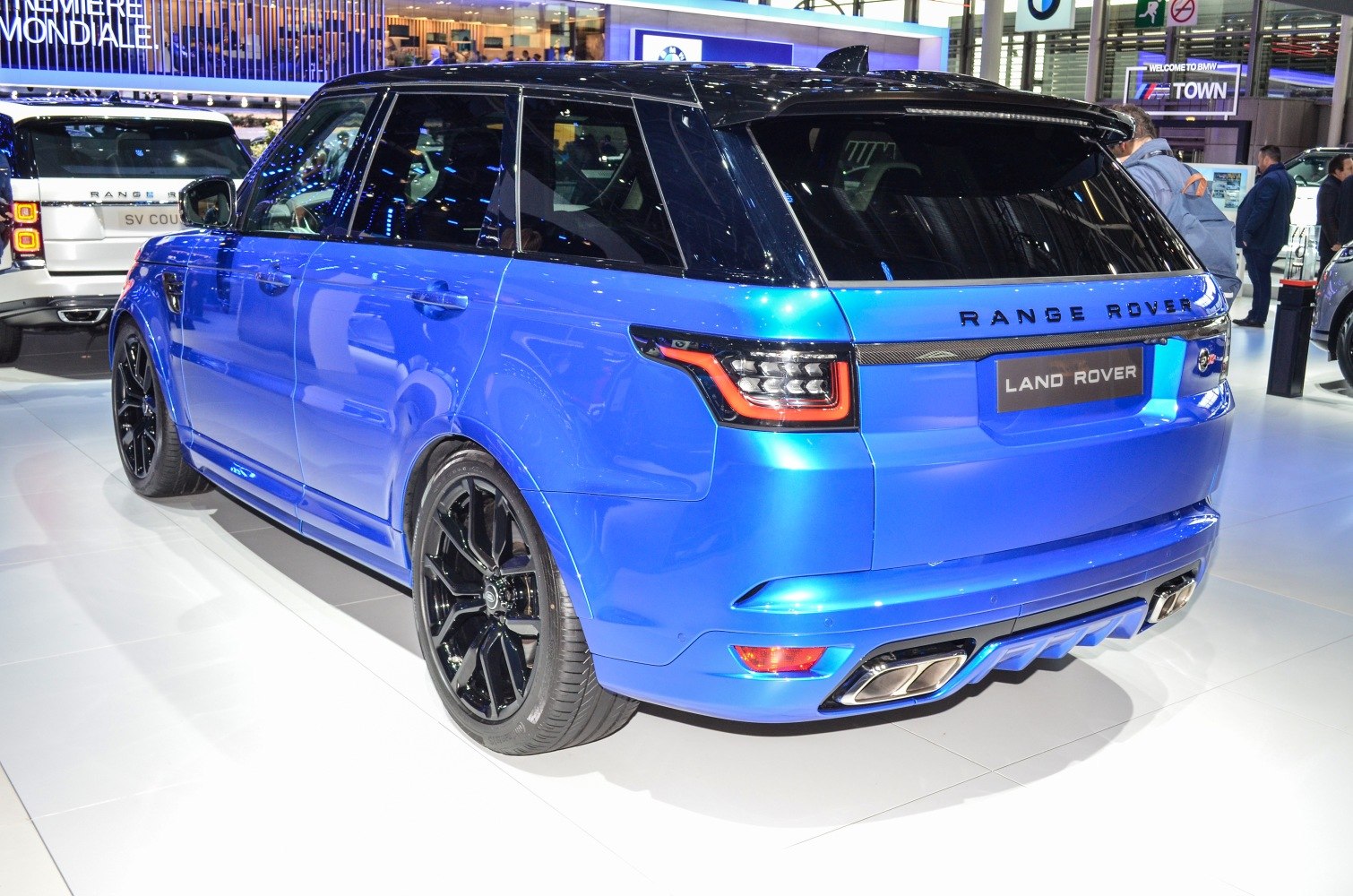 Blue SUV rear quarter with black wheels and distinctive taillights