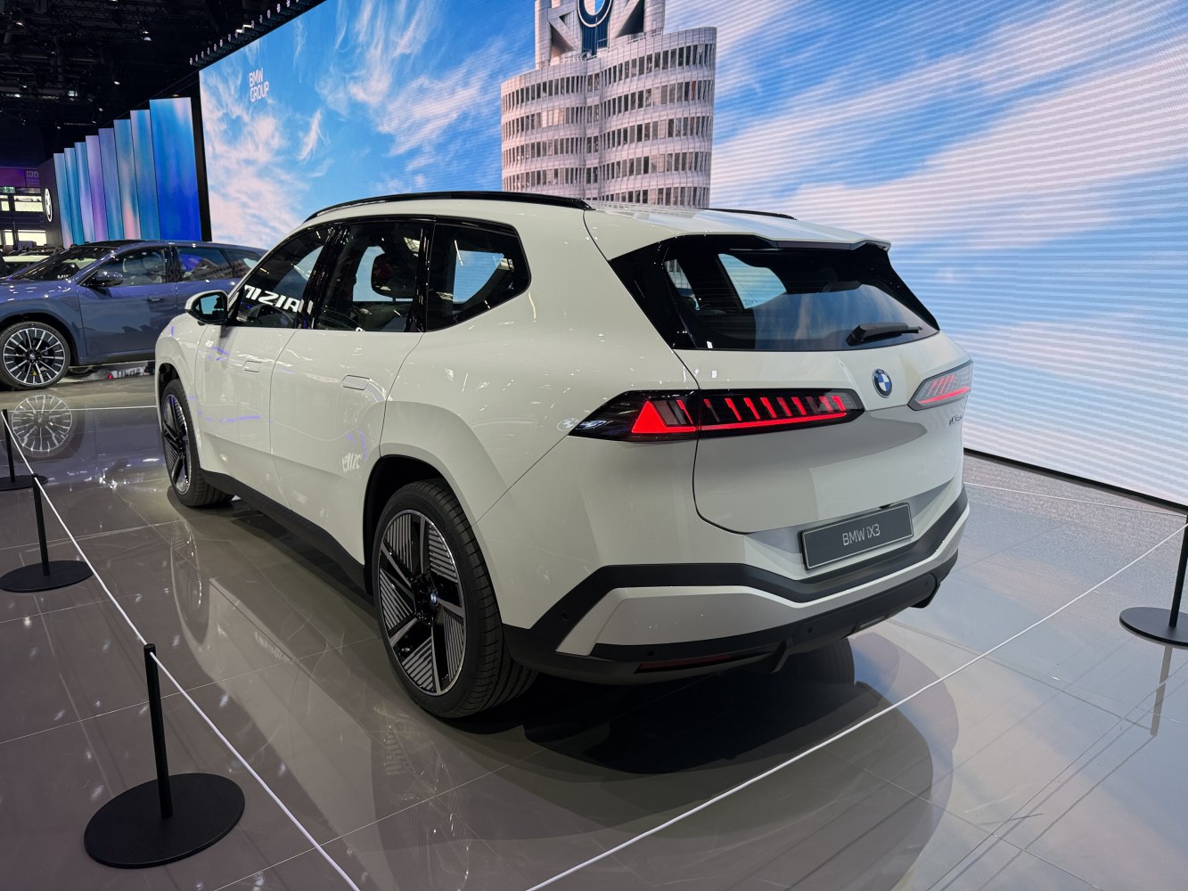 Rear view of electric SUV with horizontal LED taillights and aerodynamic wheels