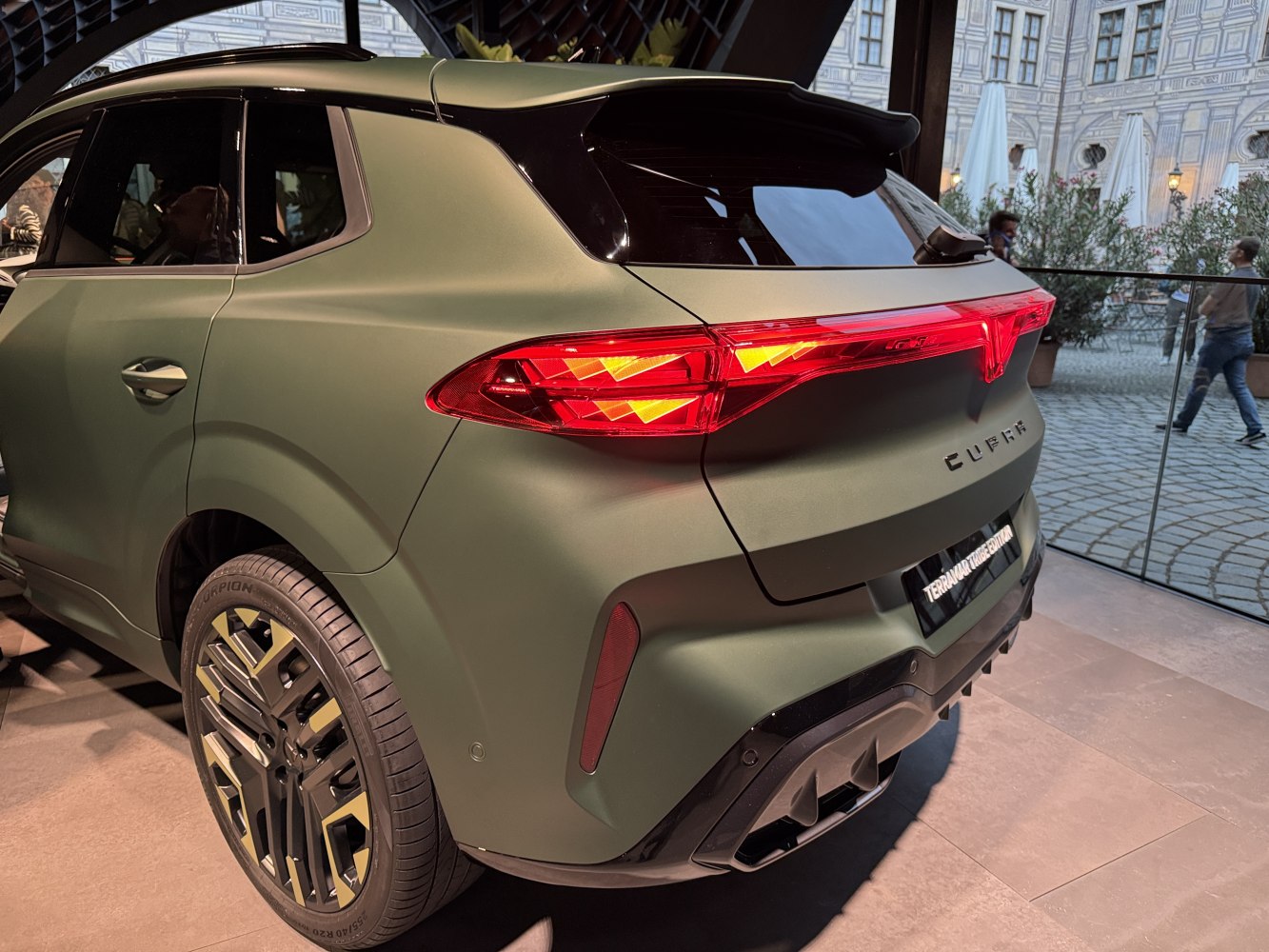 SUV rear exterior with distinctive taillights and detailed matte green finish