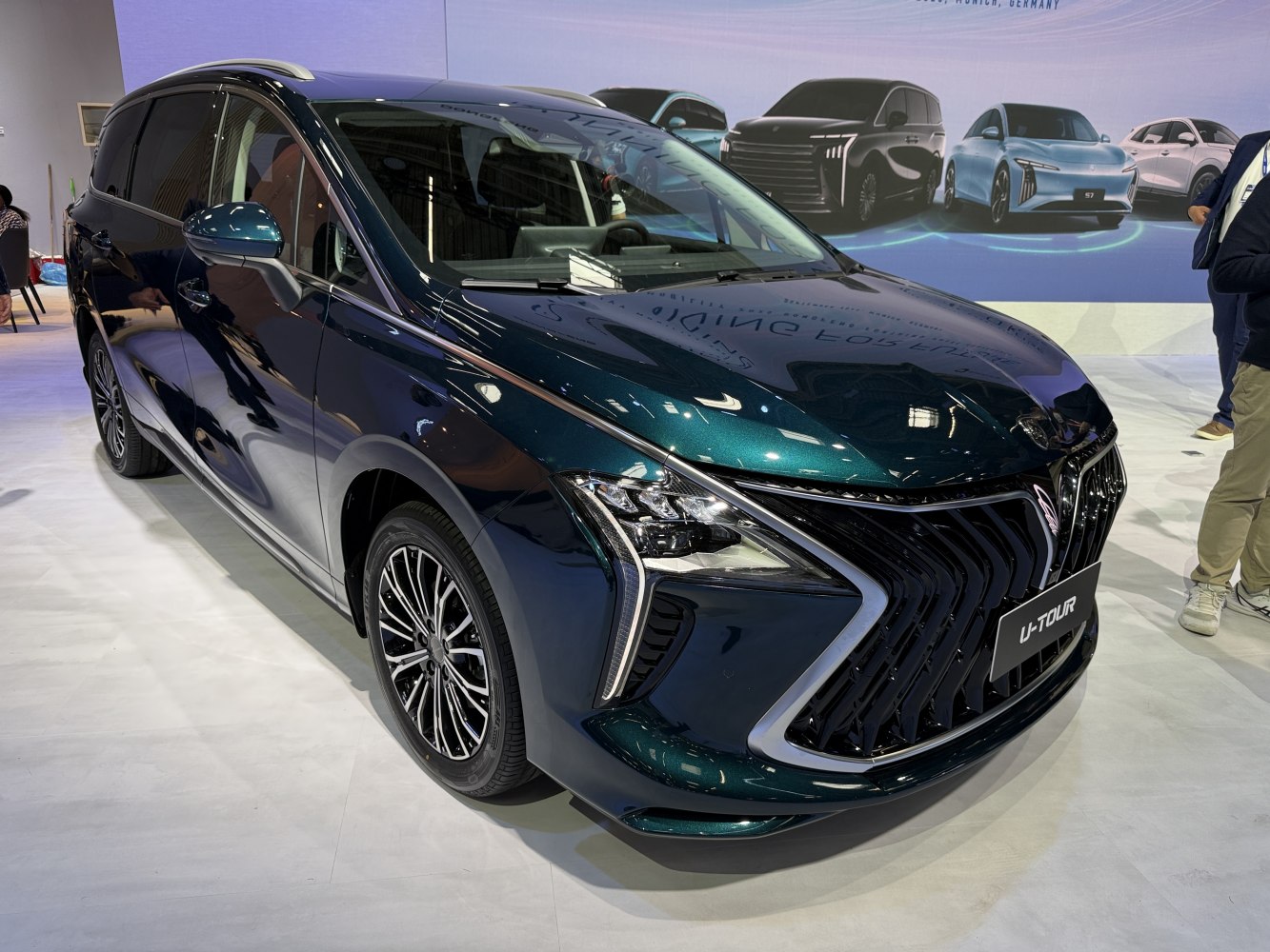 Large front grille and angular headlights on a 2022 minivan