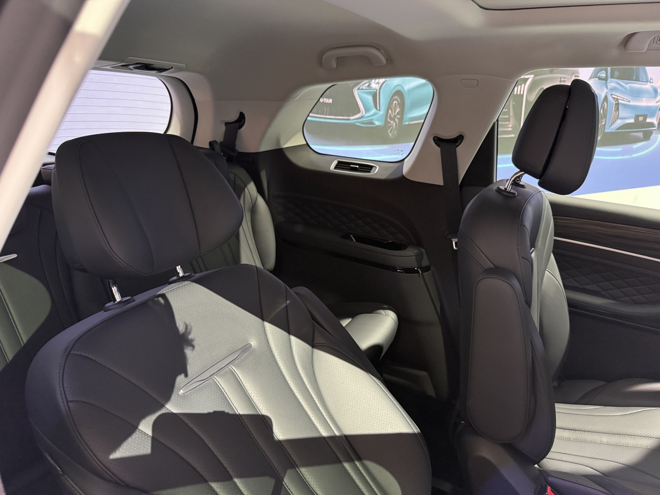 Spacious rear interior with leather upholstery and adjustable headrests