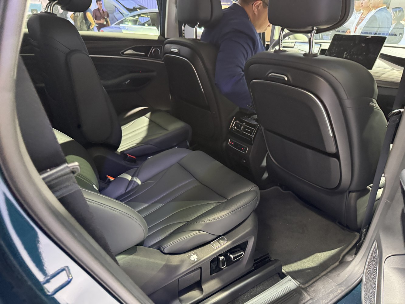 Luxury rear seats with digital adjustment and premium leather upholstery.