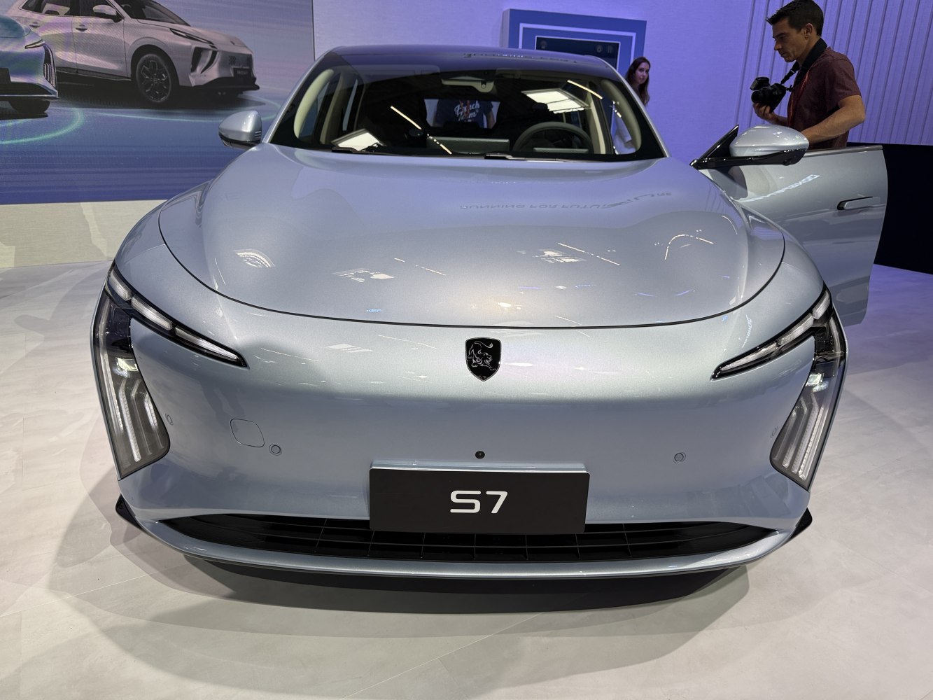 Futuristic front design with distinctive LED headlights and sleek bumper.