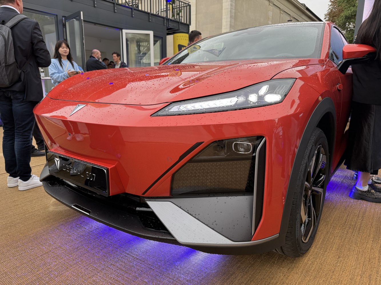 Sleek front fascia and advanced LED headlights with blue underglow lighting.