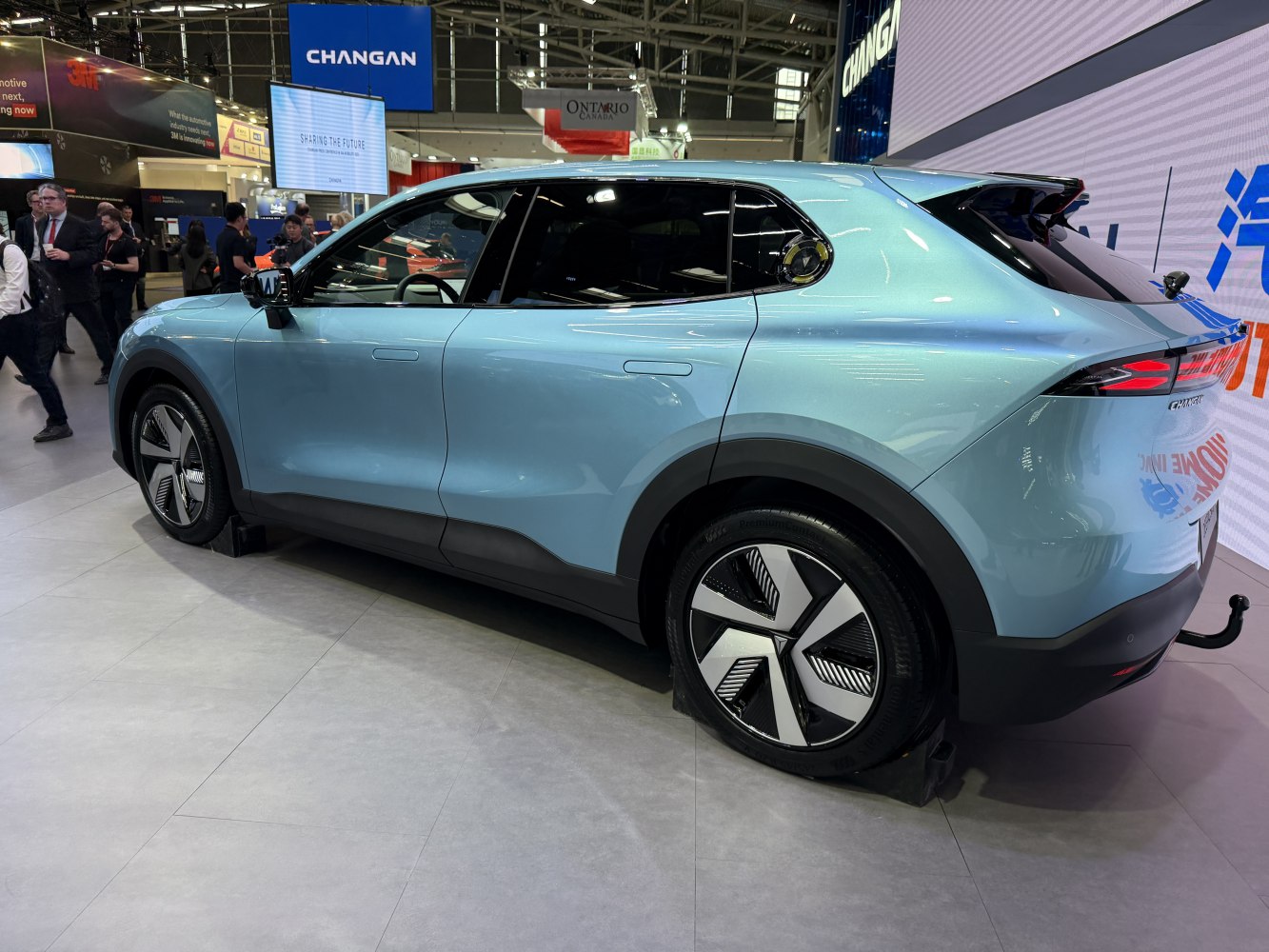 Sleek side profile of SUV with aerodynamic wheels and flush door handles.