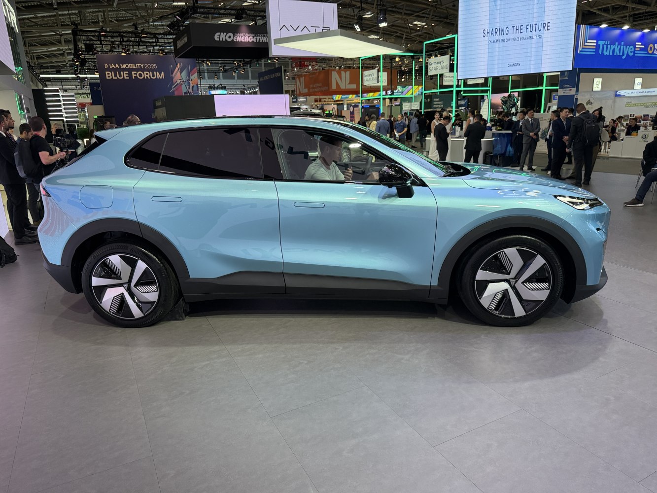 Side profile of electric SUV with aerodynamic wheels and sleek windows