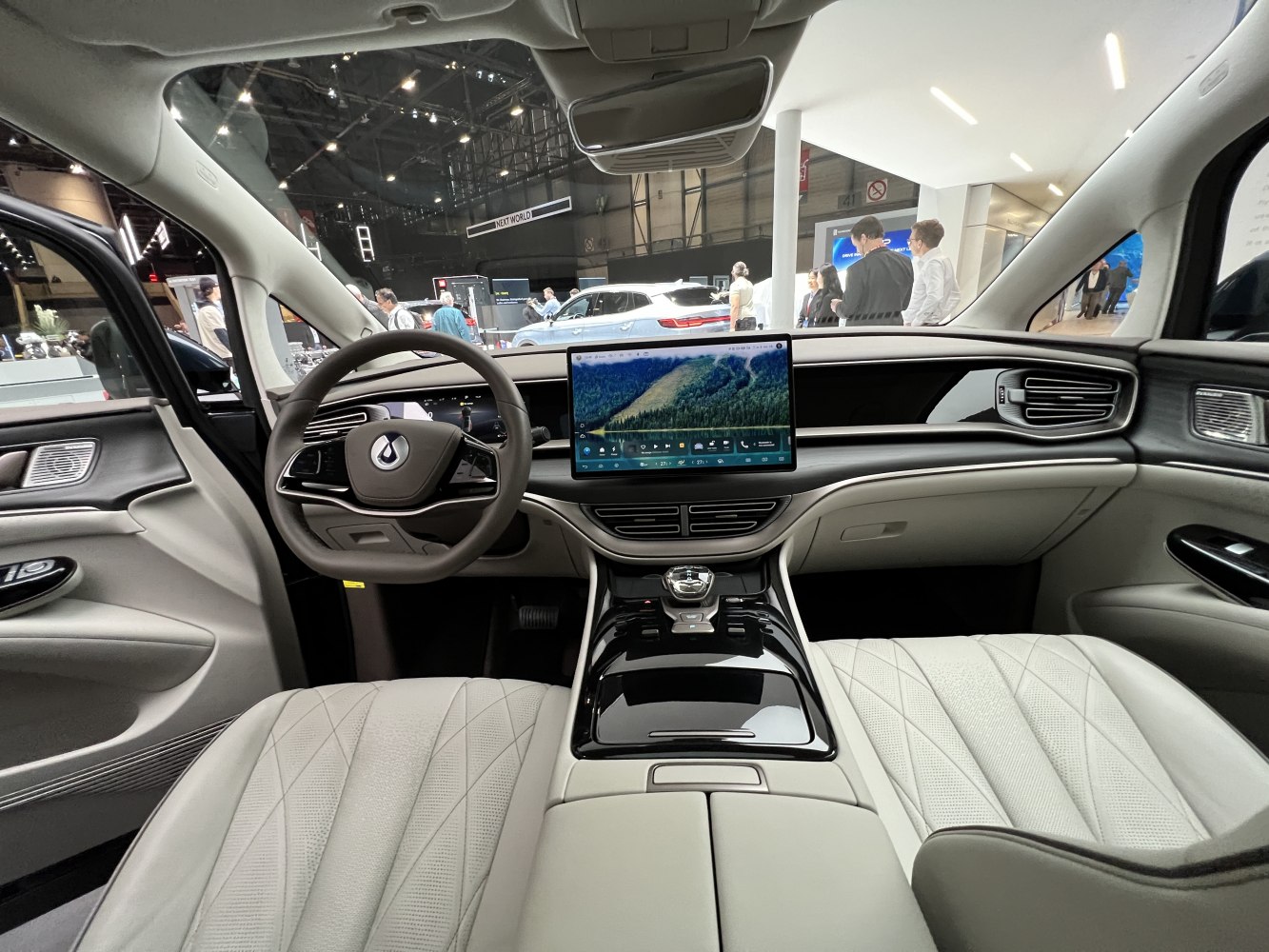 Modern dashboard with large touchscreen and premium seats