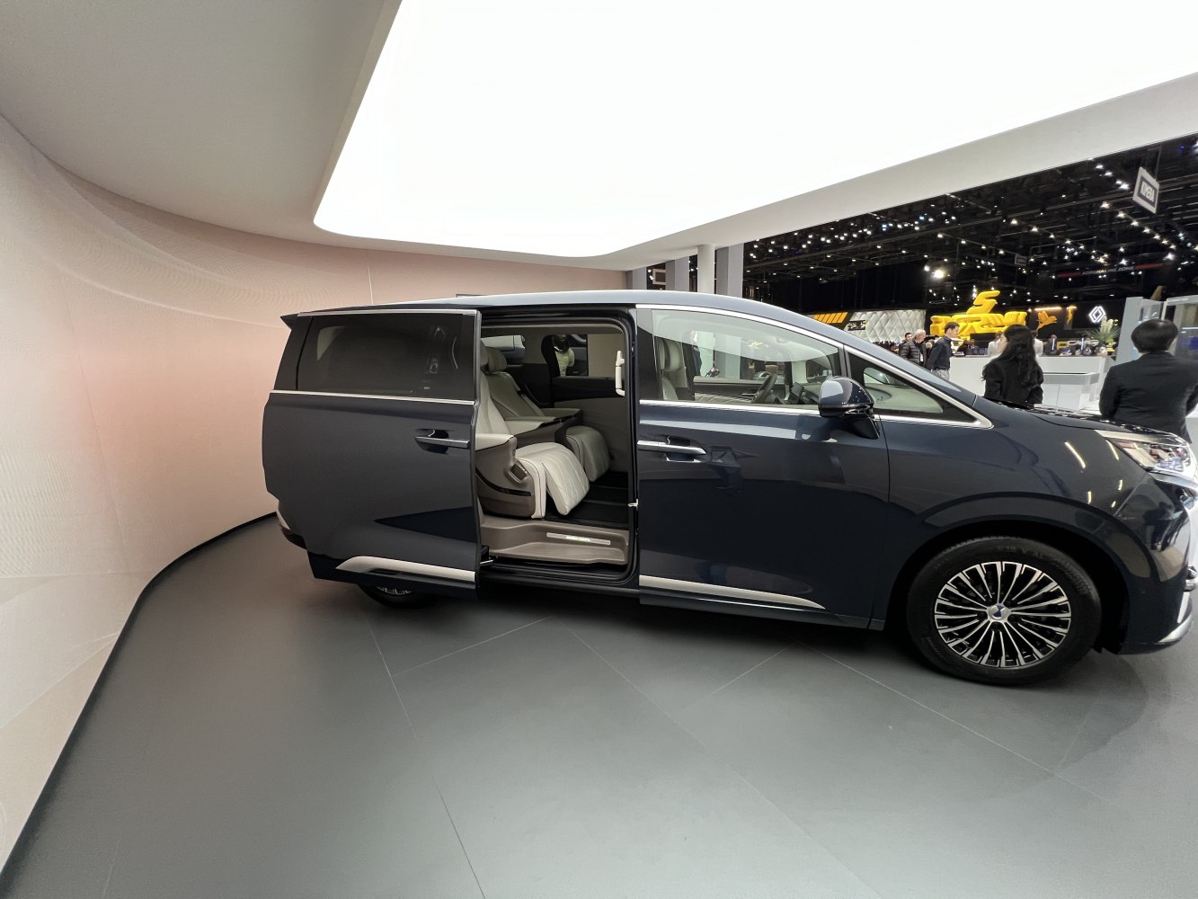 Sliding door open revealing spacious, luxurious interior seating