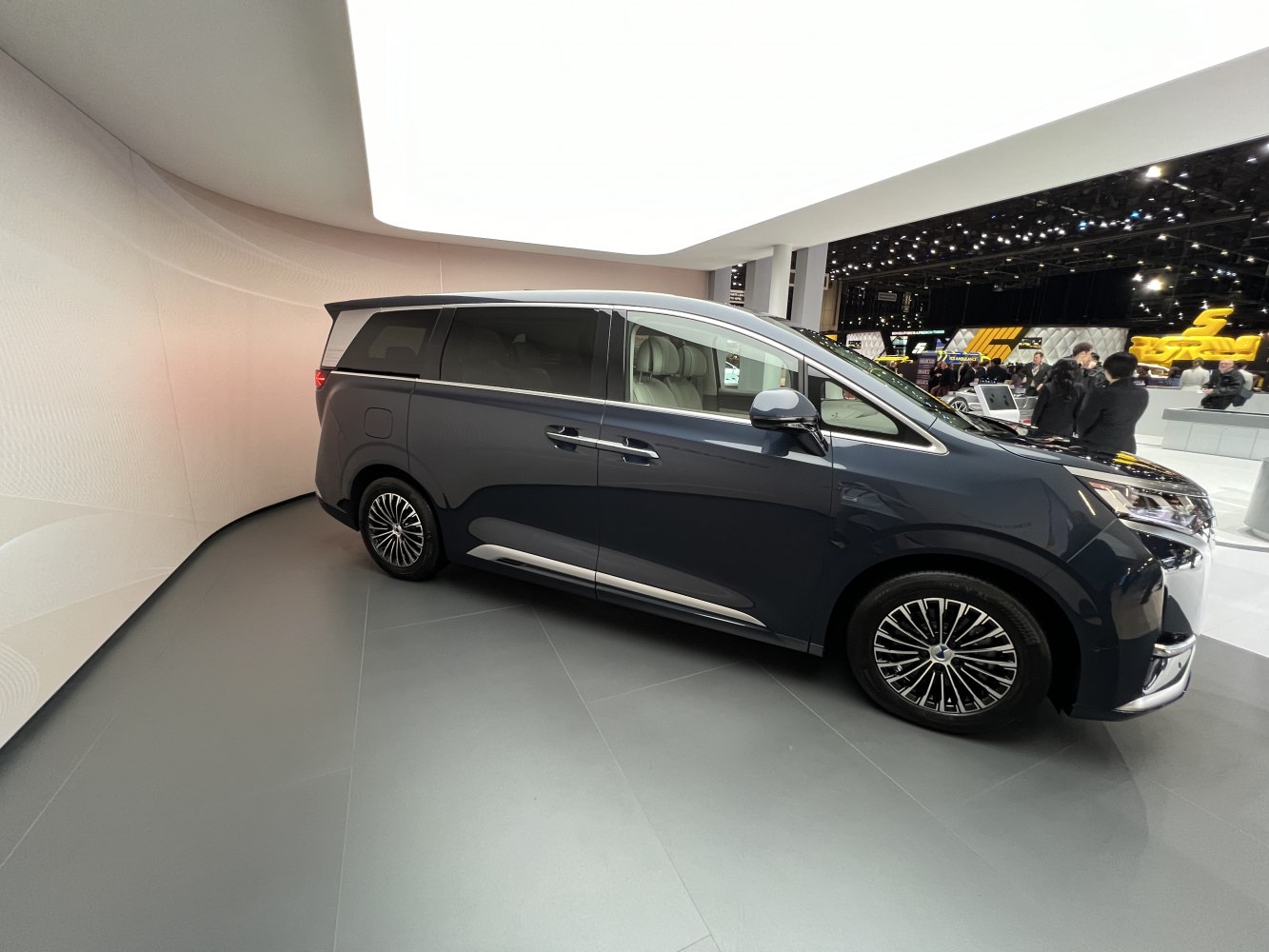 Side profile of an MPV with sliding rear doors and alloy wheels