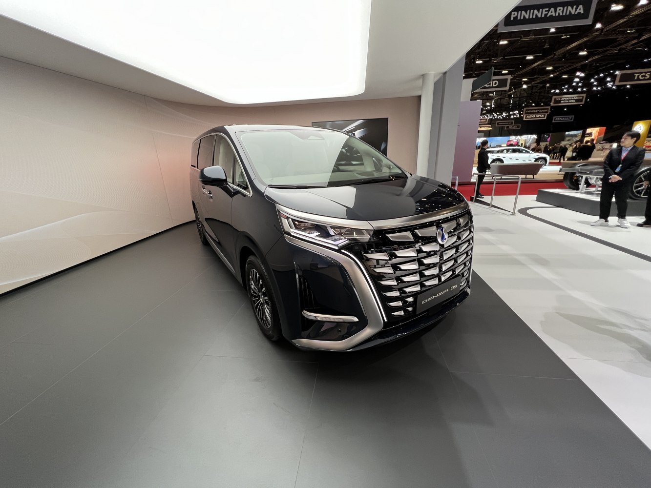 Luxury minivan front with detailed grille and LED headlights