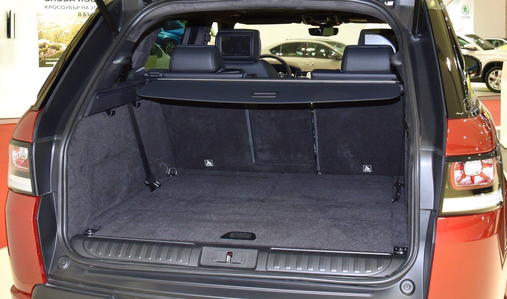 Spacious rear cargo area with retractable cover inside SUV