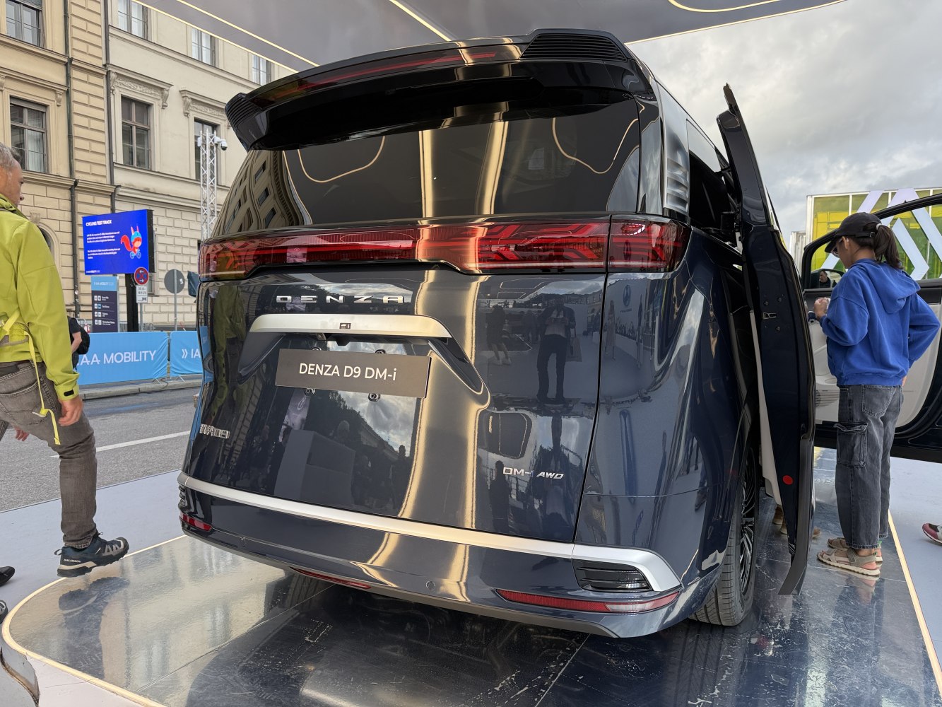 Sleek rear with split continuous taillight and vertical rear door