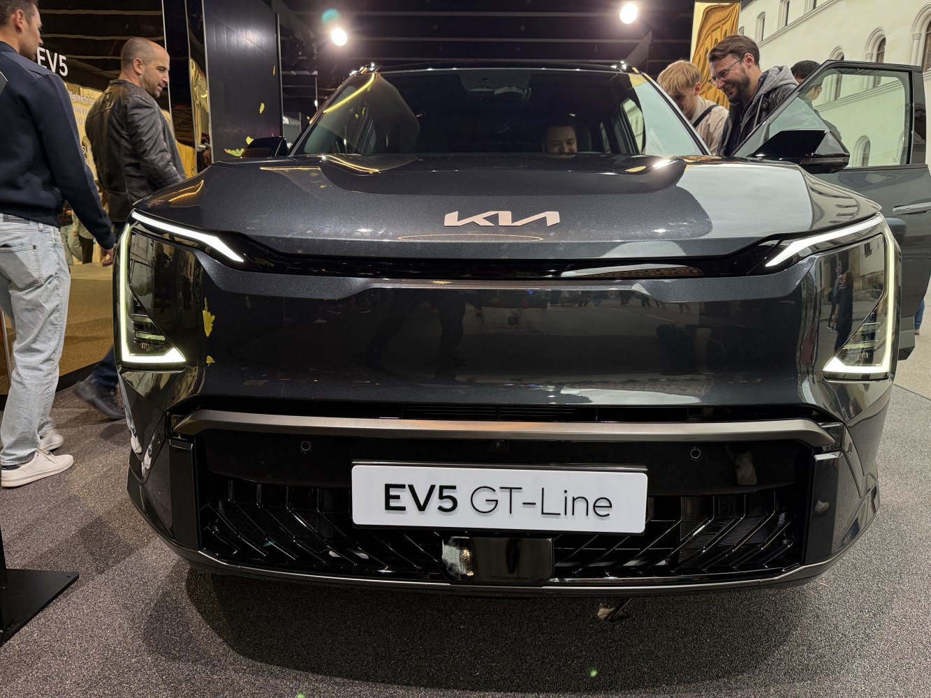 Front view of electric SUV with LED headlights and a bold grille design