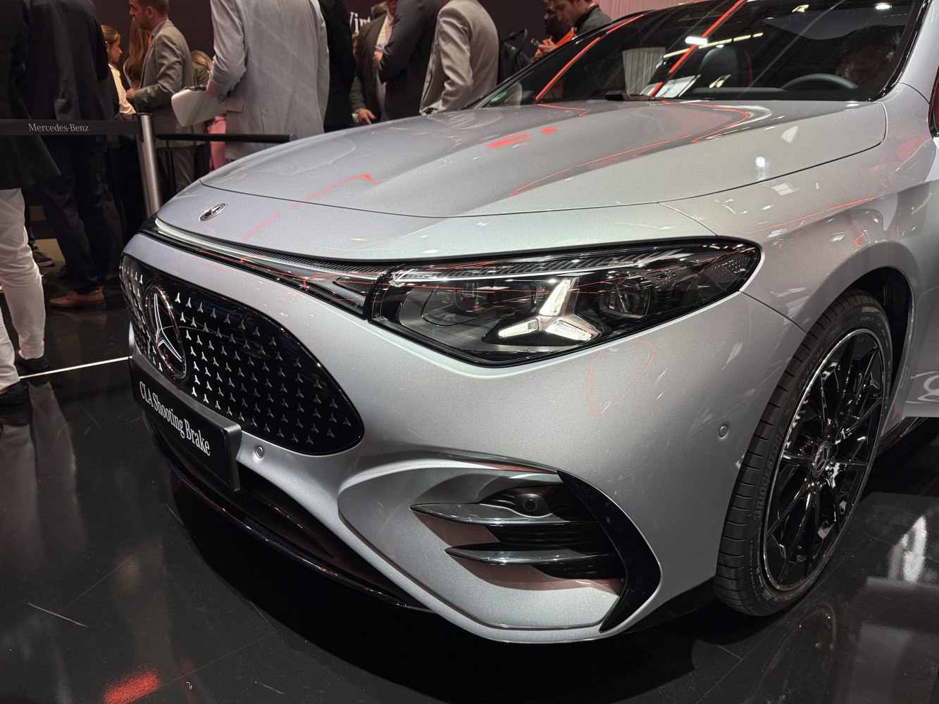 Front detail with sleek headlights and distinctive grille design