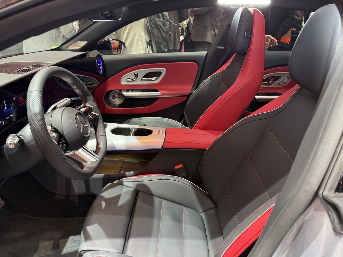Red and black leather seats with advanced steering wheel and dashboard.