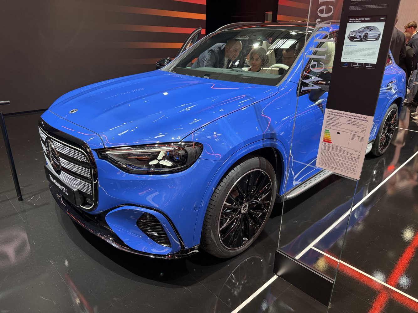 Electric SUV front grille and black alloy wheels in bright blue