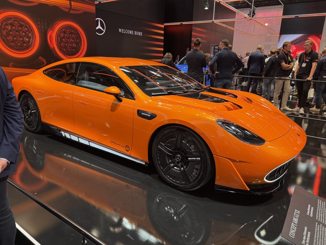 Aerodynamic hood vents and black multispoke alloy wheels on a sleek sport sedan