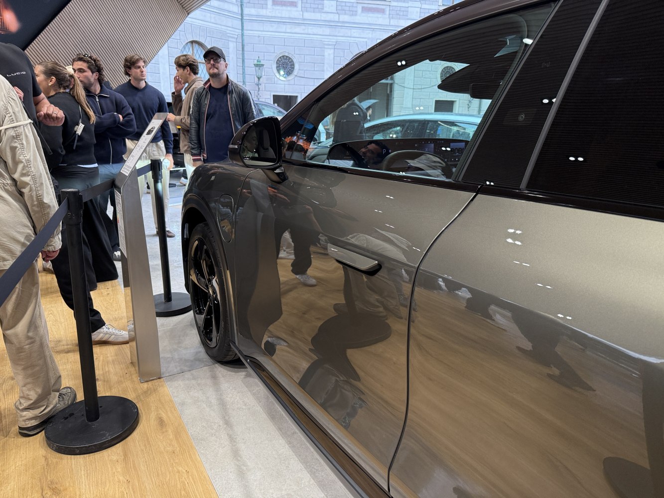 Side door, black alloy wheel, and side mirror of a modern SUV