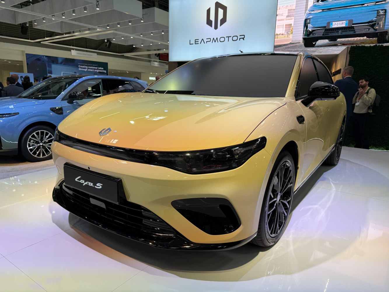 Streamlined electric sedan front with LED headlights and sporty wheels