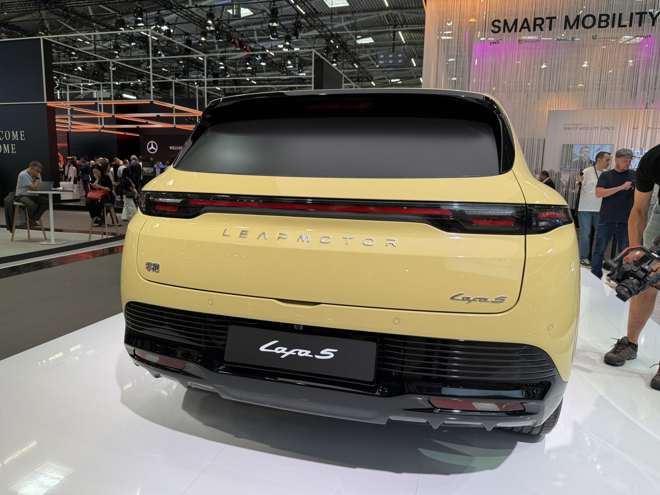 Rear view with continuous LED tail light strip and hatchback design