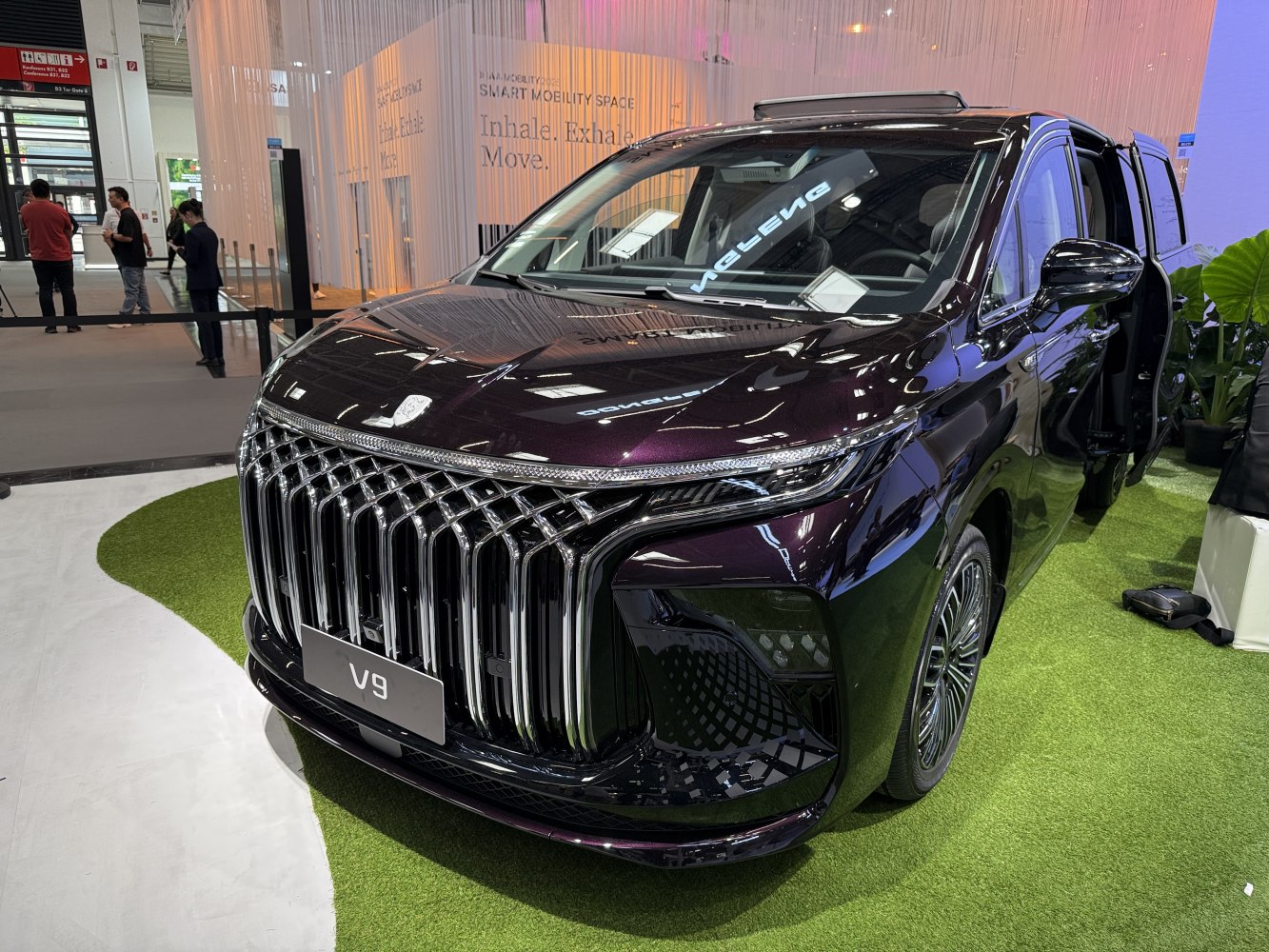 Front grille and sleek LED headlights of a luxury MPV