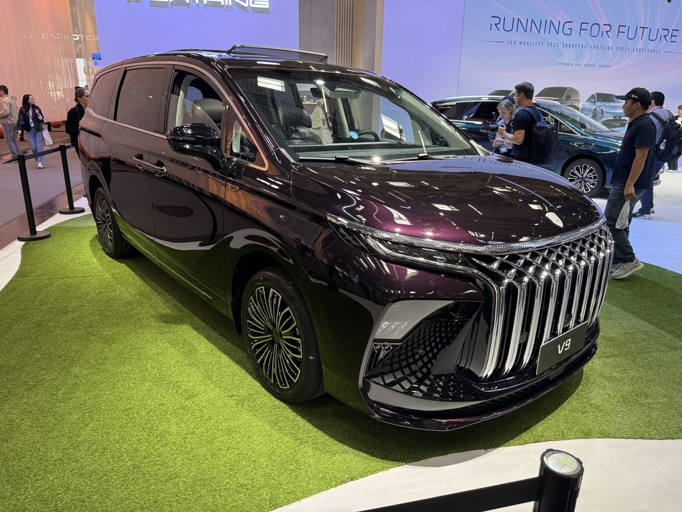 MPV with vertical chrome grille and sleek aerodynamic front design