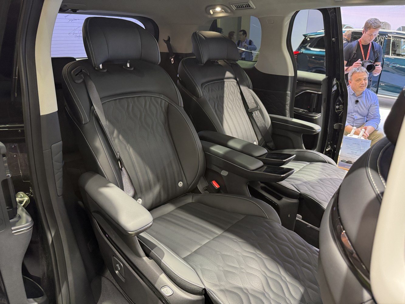 Premium leather captain seats with armrests and seatbelt