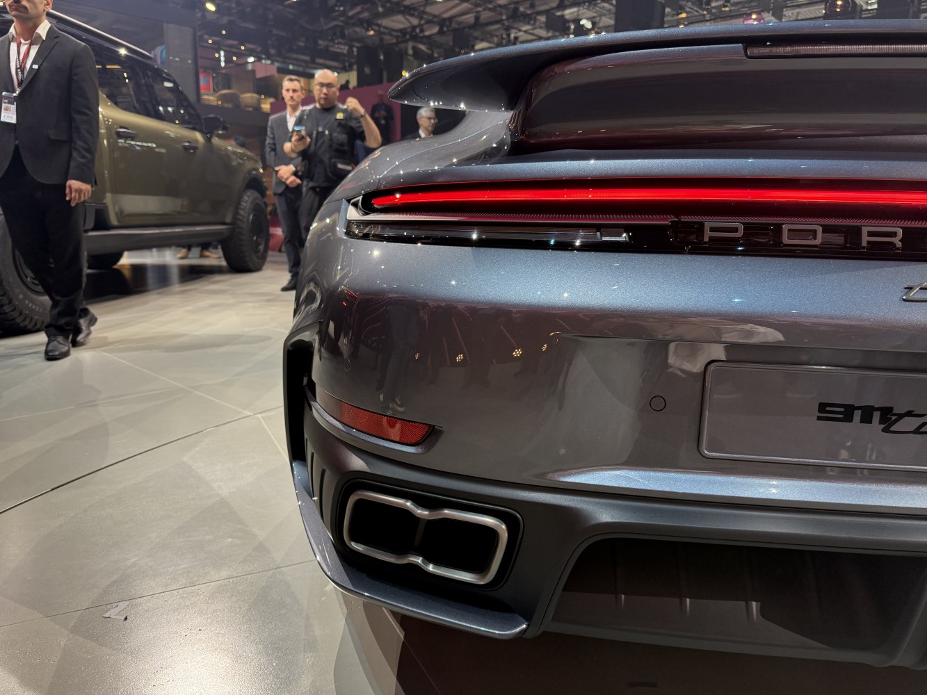 Rear tail light and dual exhaust design of a modern sports car
