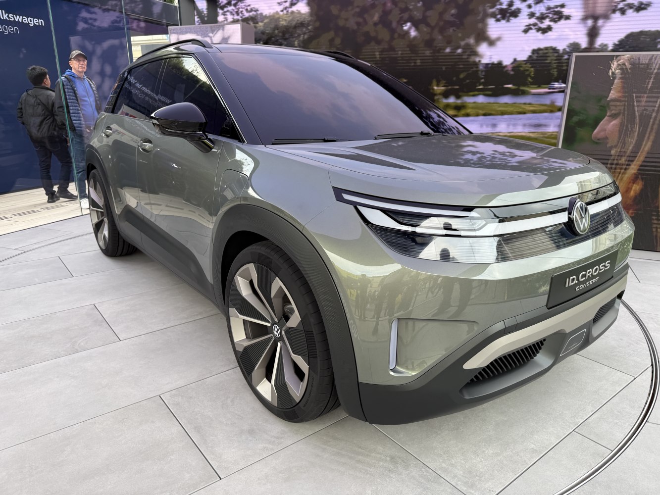 Futuristic electric SUV front with aerodynamic LED headlights and large alloy wheels